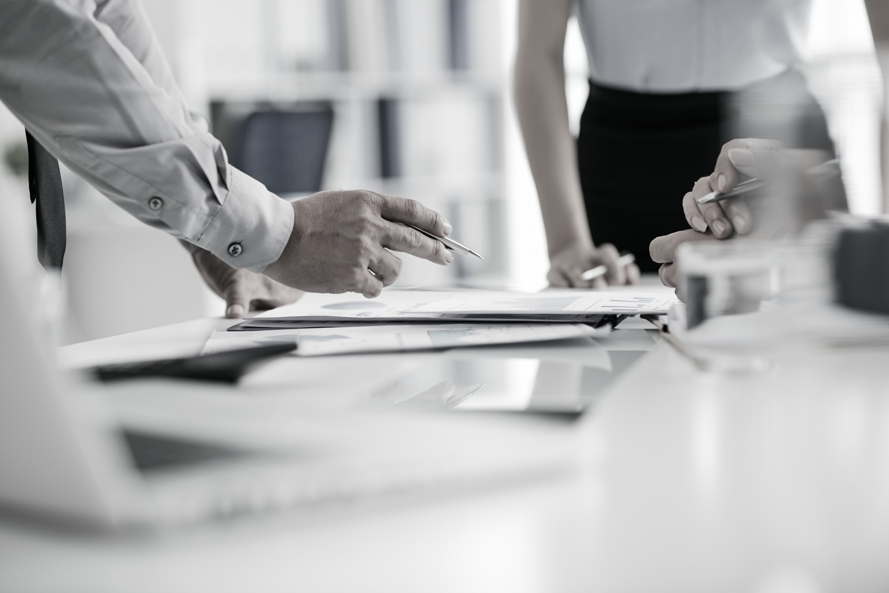 Analysts reviewing financial documents